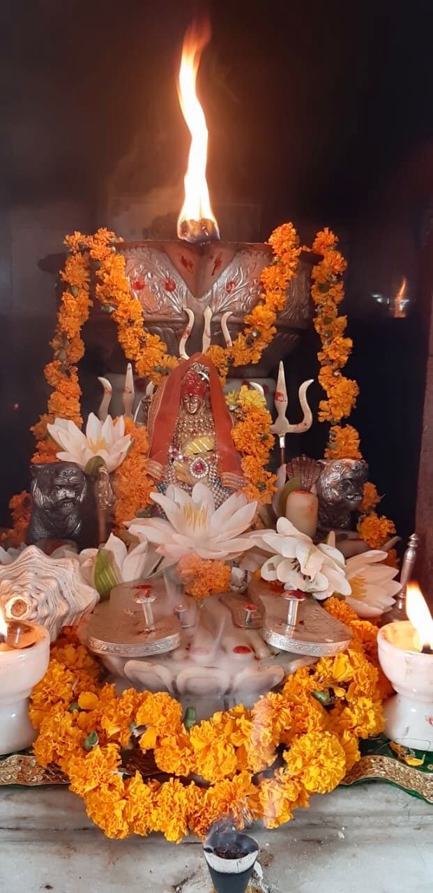 Ambe Maa adorned with marigold flowers