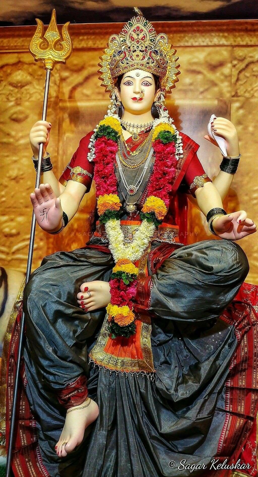 Ambe Maa blesses devotees with a radiant smile.