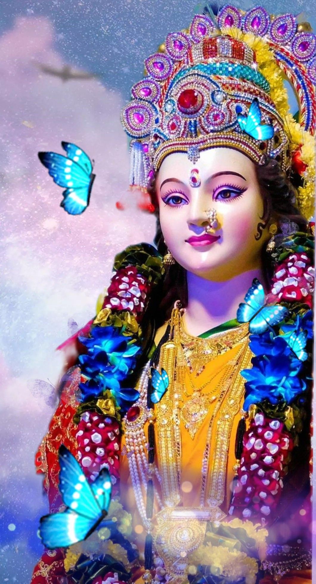 Ambe Maa with butterflies, close-up portrait.