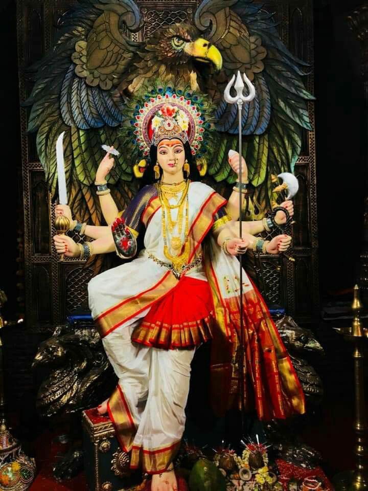 Ambe Maa holding sword and trident.