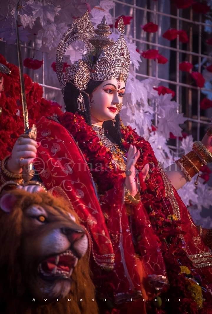 Ambe Maa in radiant red attire
