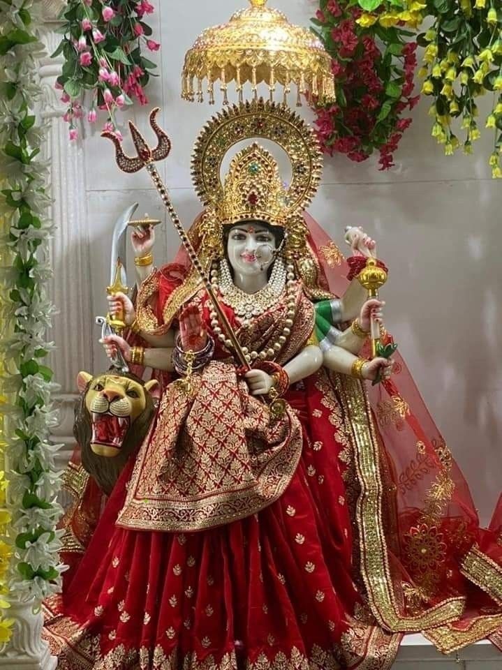 Ambe Maa with lion and trident statue