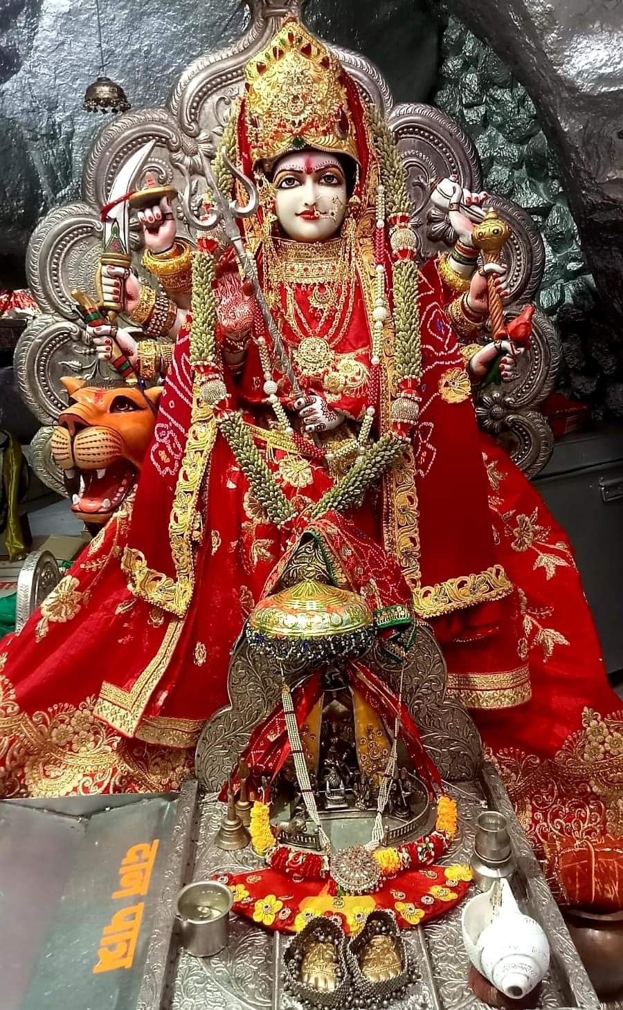 Ambe Maa in red saree with eight arms