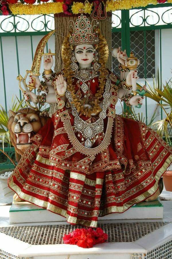 Ambe Maa seated on a lion throne