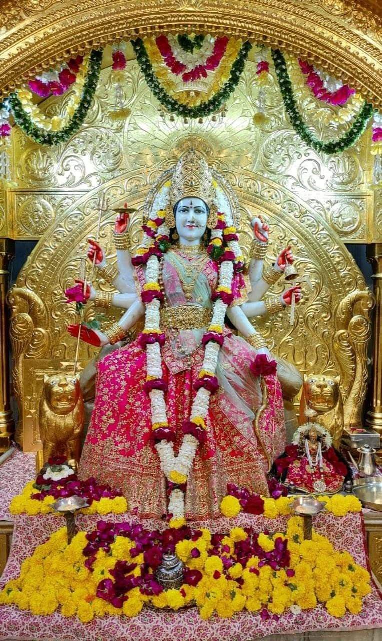 Ambe Maa seated on a throne