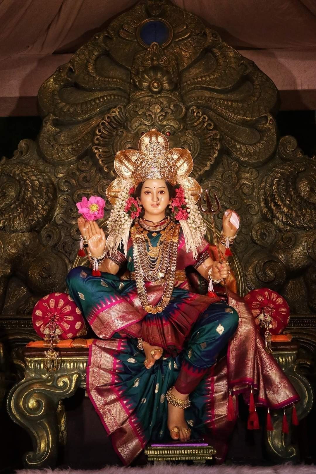 Ambe Maa seated on her throne.