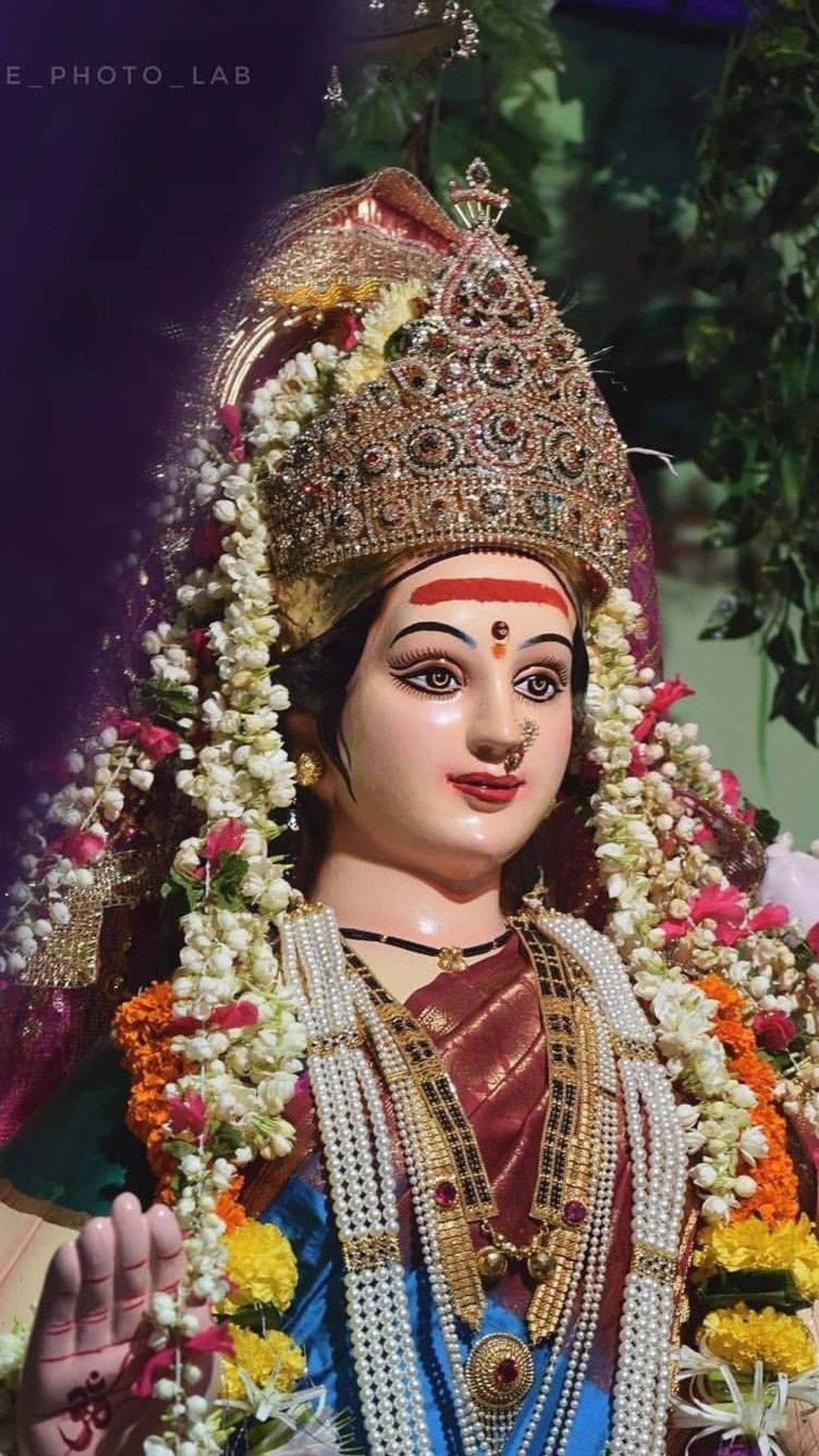 Ambe Maa adorned with flowers and jewelry