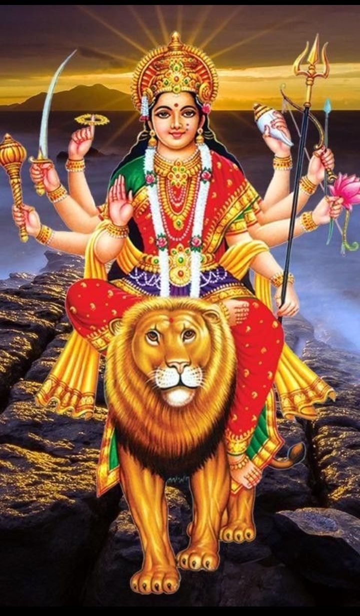 Ambe Maa riding a golden lion.