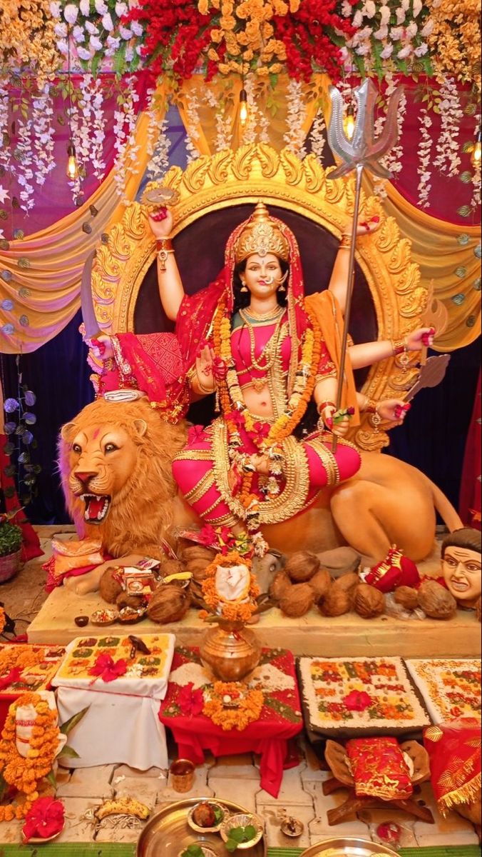 ambe maa seated on a lion throne