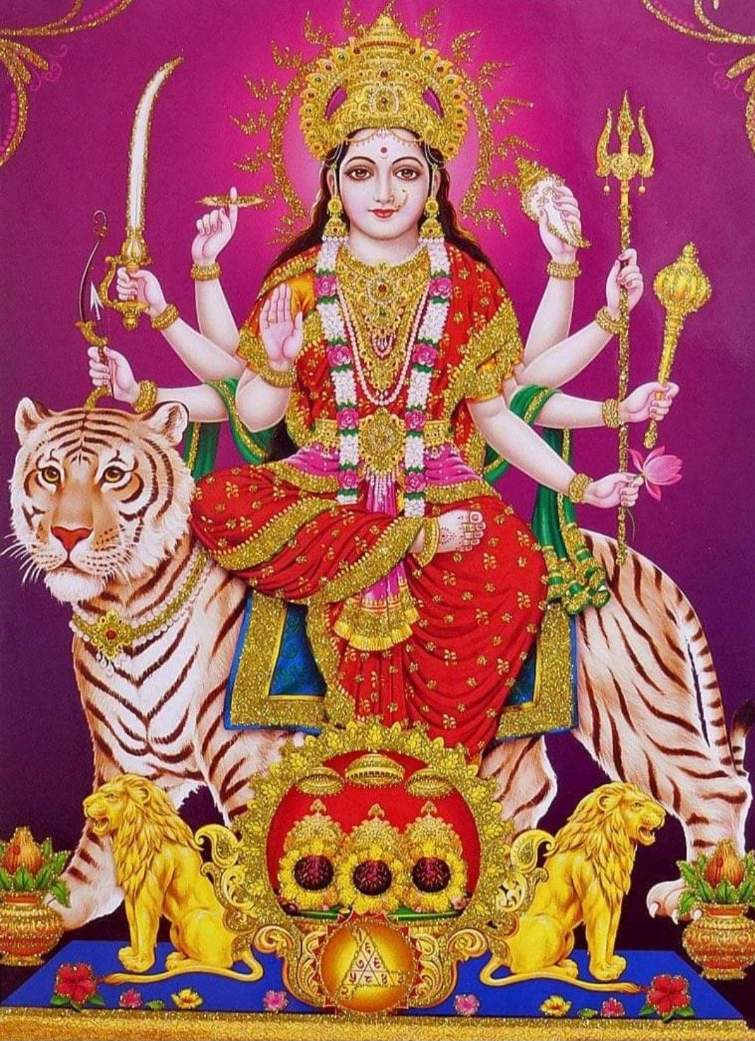 Ambe Maa seated on tigers, divine.