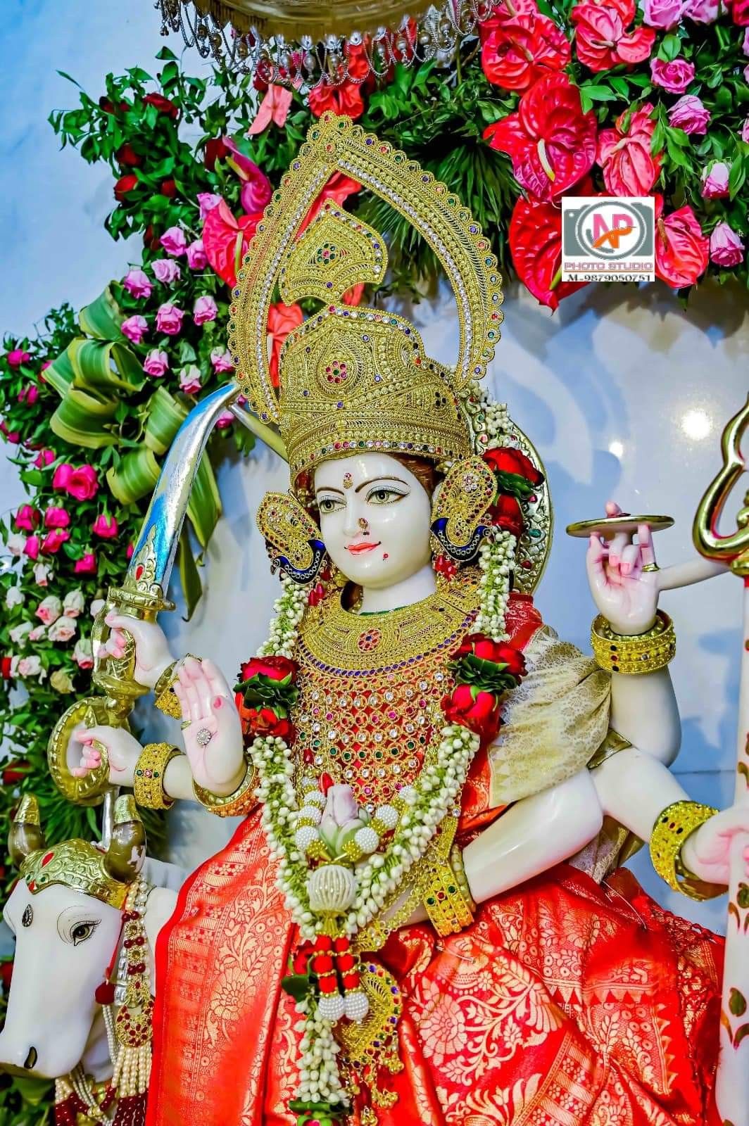 Ambe Maa statue adorned with flowers