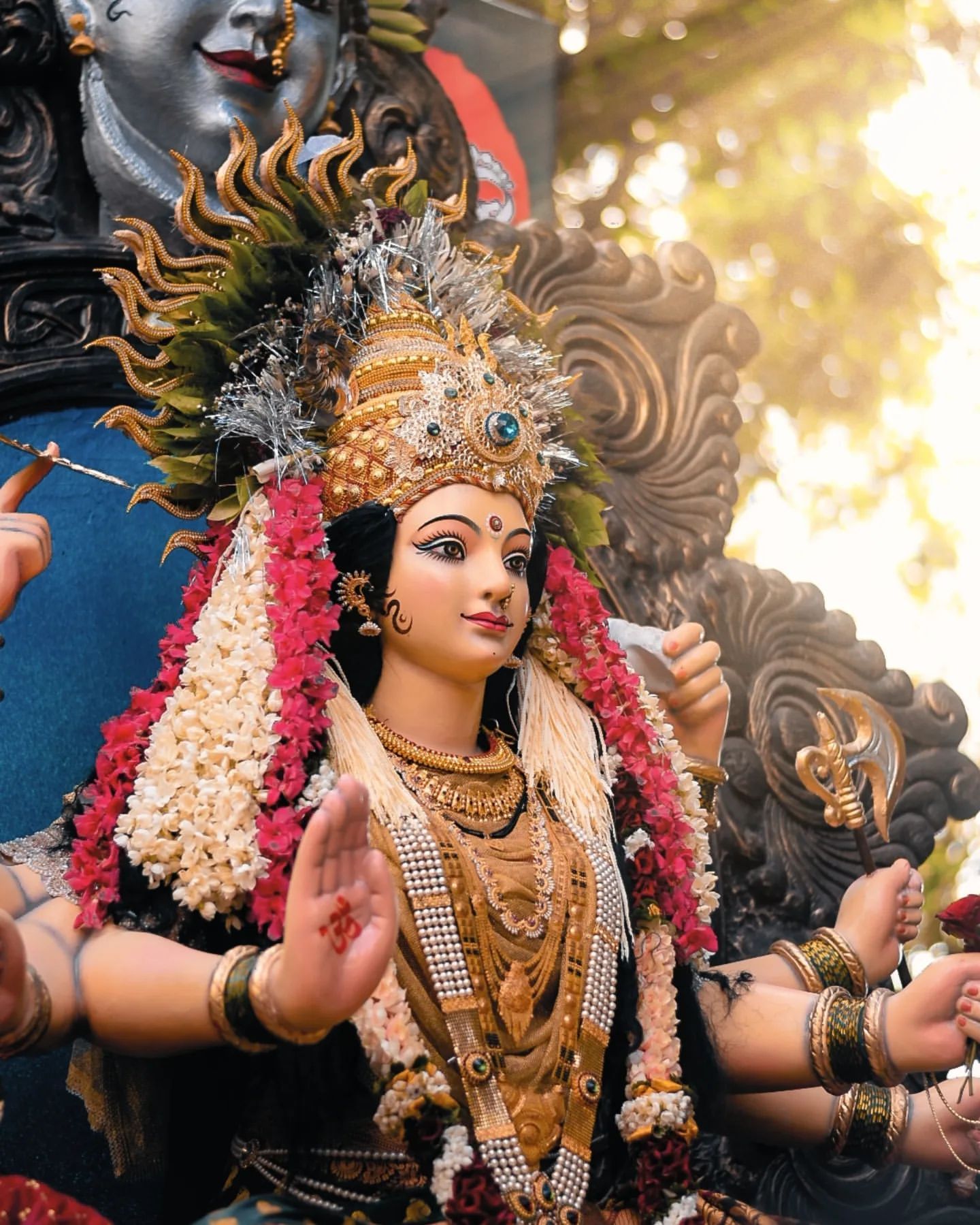 Ambe Maa with floral decorations, golden jewelry