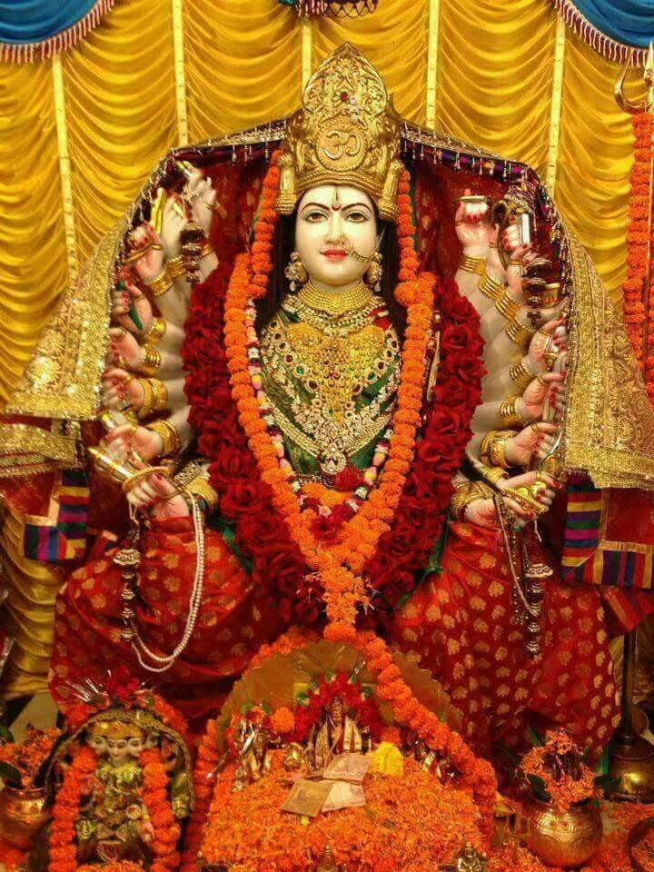 Divine Ambe Maa in red saree.