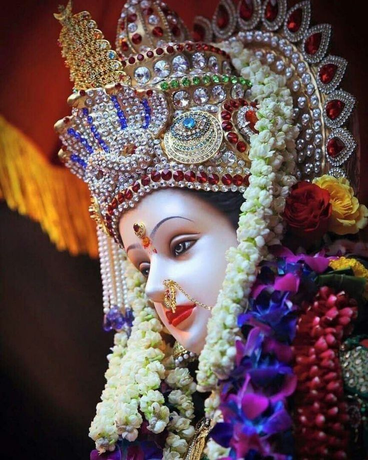 Ambe Maa adorned with flowers and jewels.