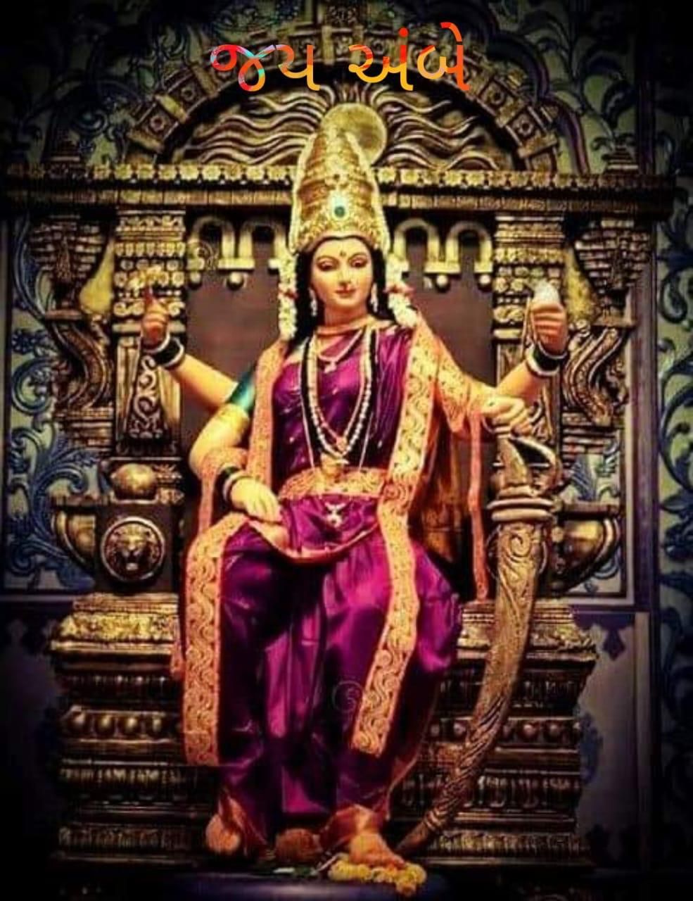 Ambe Maa seated on a golden throne