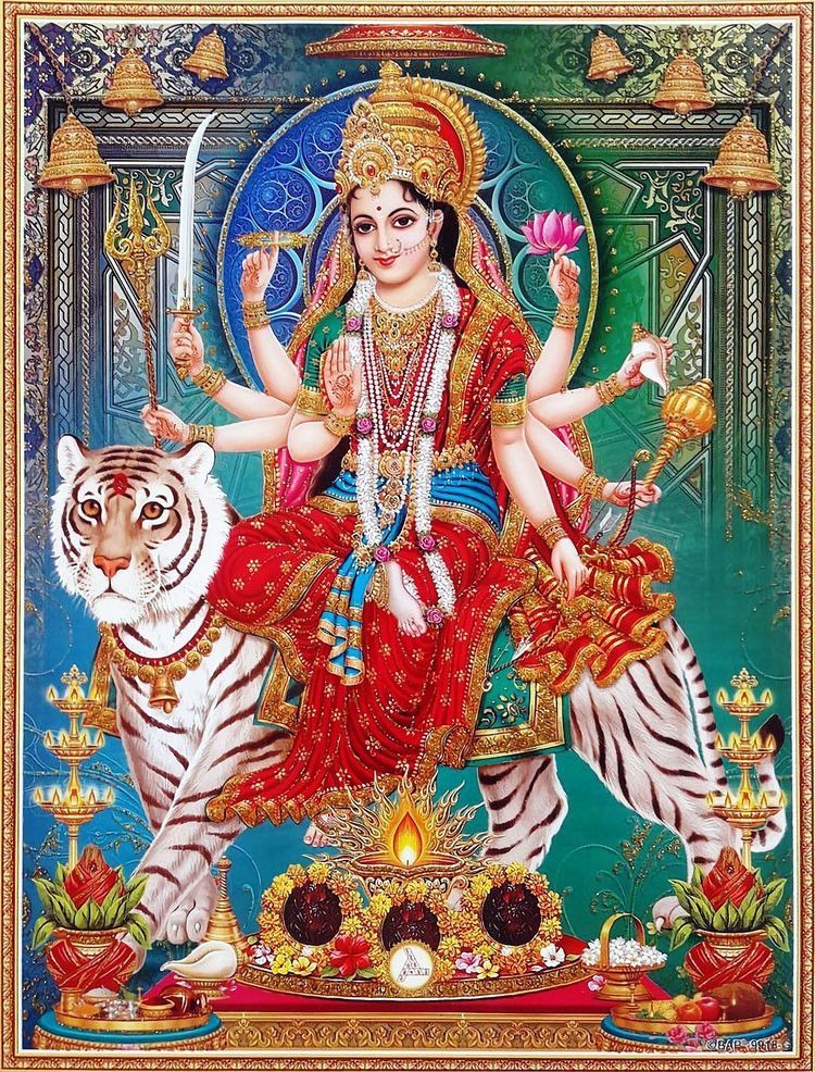 Ambe Maa riding a tiger and lion.