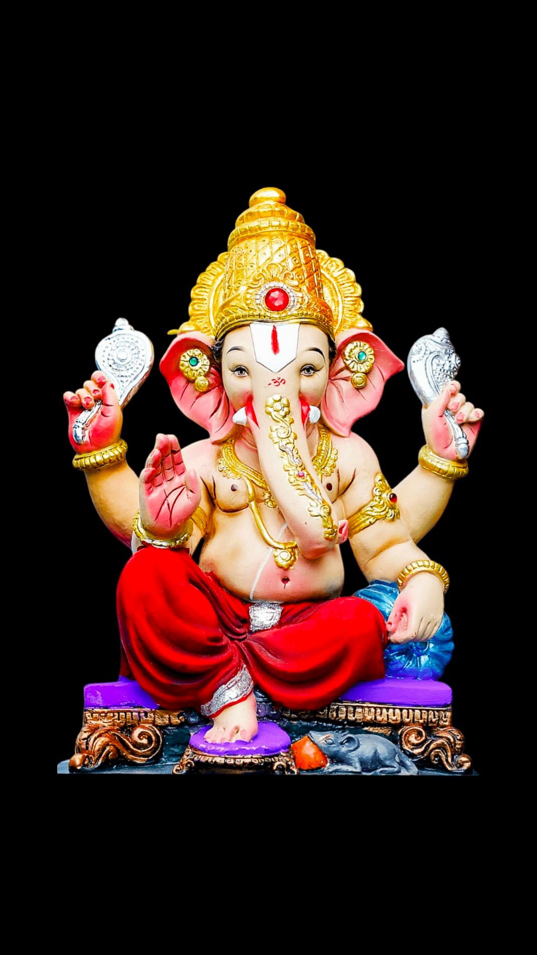 Lord Ganesha bestows blessings with open hands.