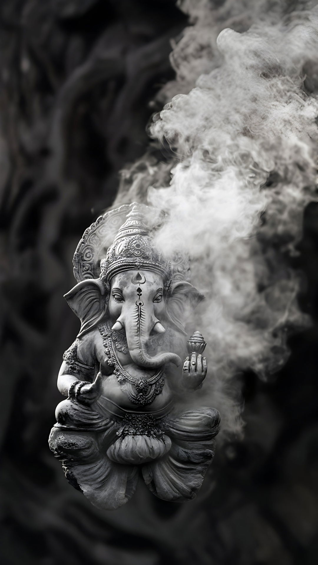 Ganesha statue amidst swirling smoke