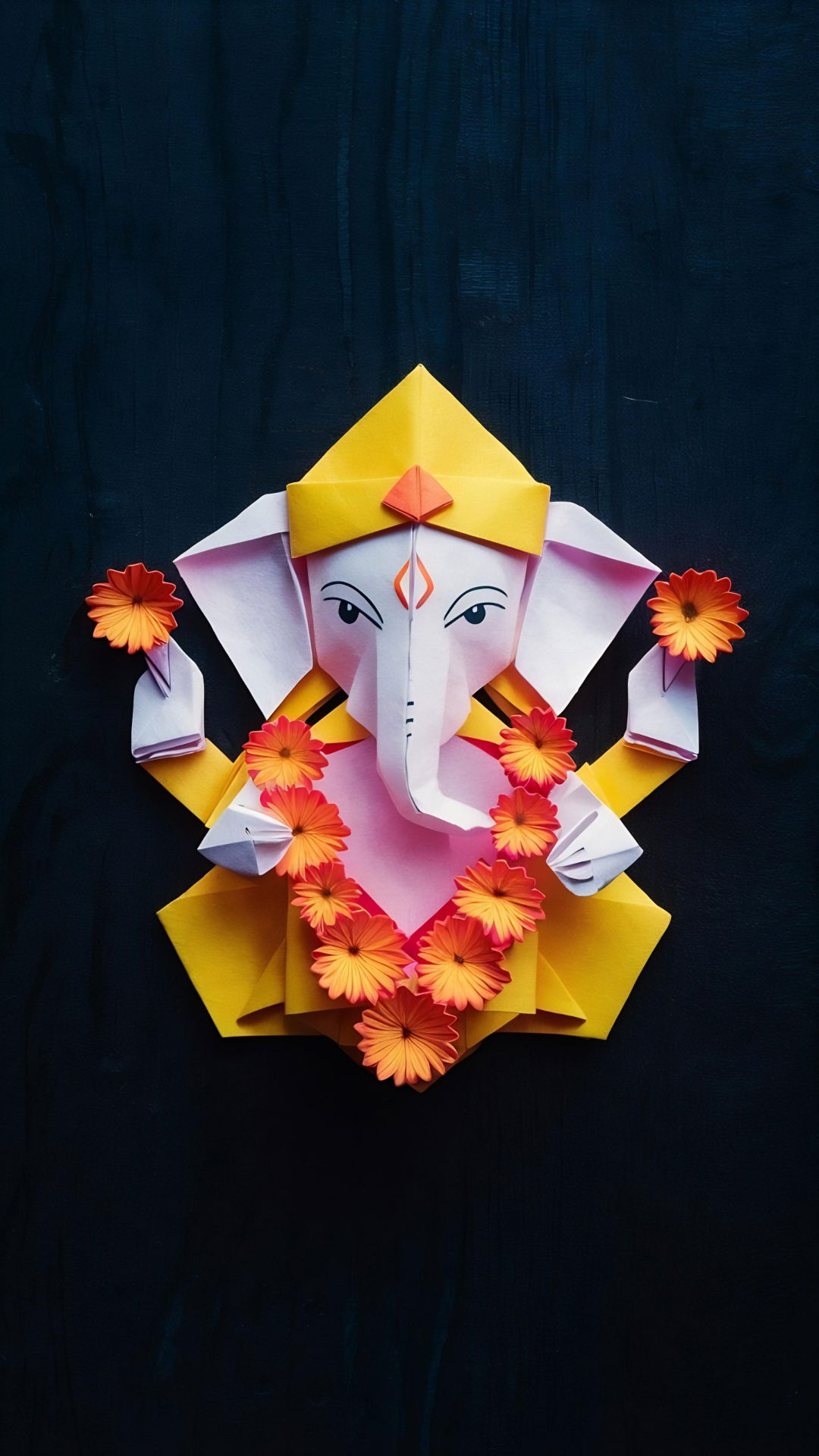 Origami Ganesha with orange flowers.