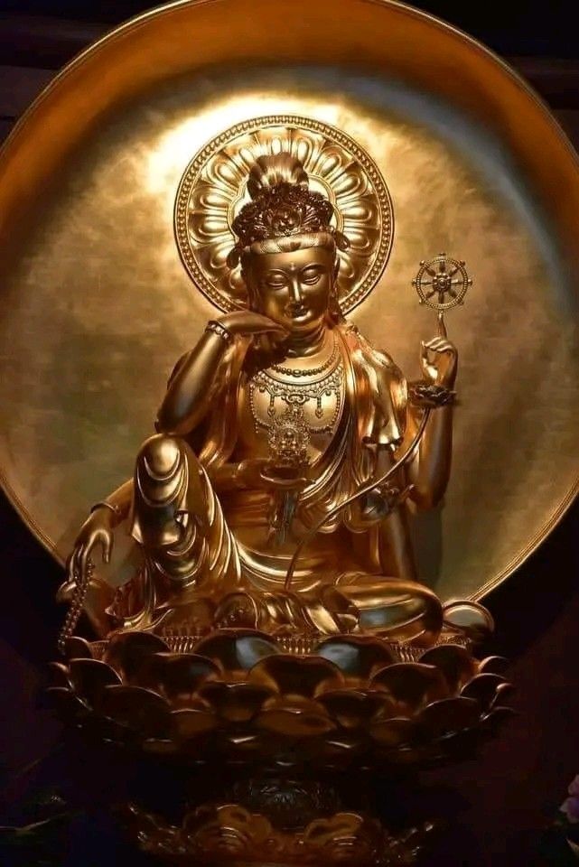 Golden Buddha in meditative pose.
