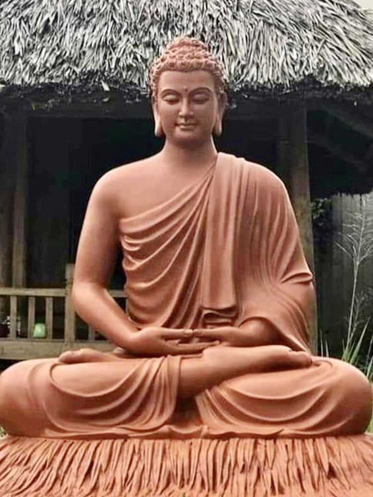 Buddha meditating in lotus position