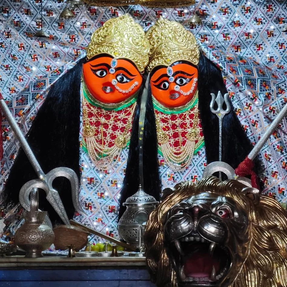 Two-headed Chamunda Maa with lion.