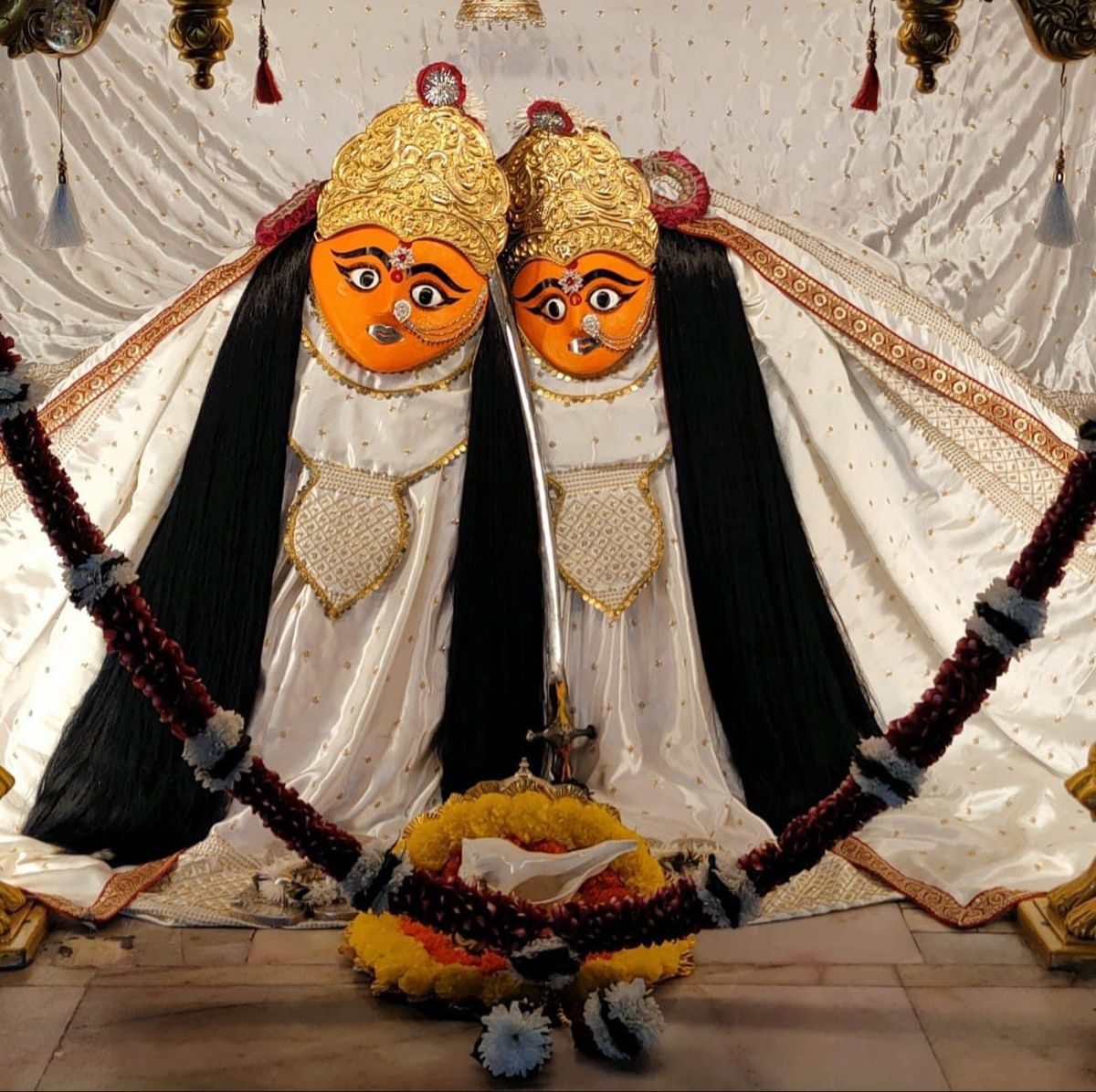 Chamunda Maa\'s dual-faced devotional image.