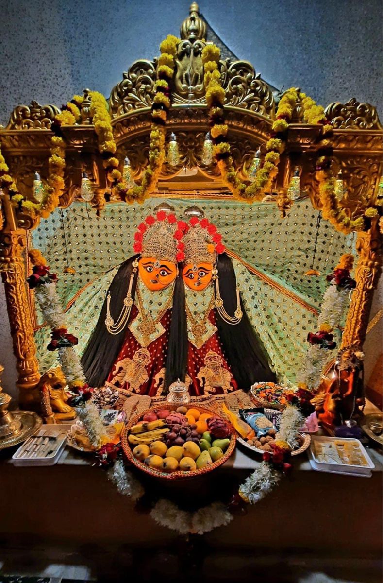 Two-faced Chamunda Maa with fruit offering