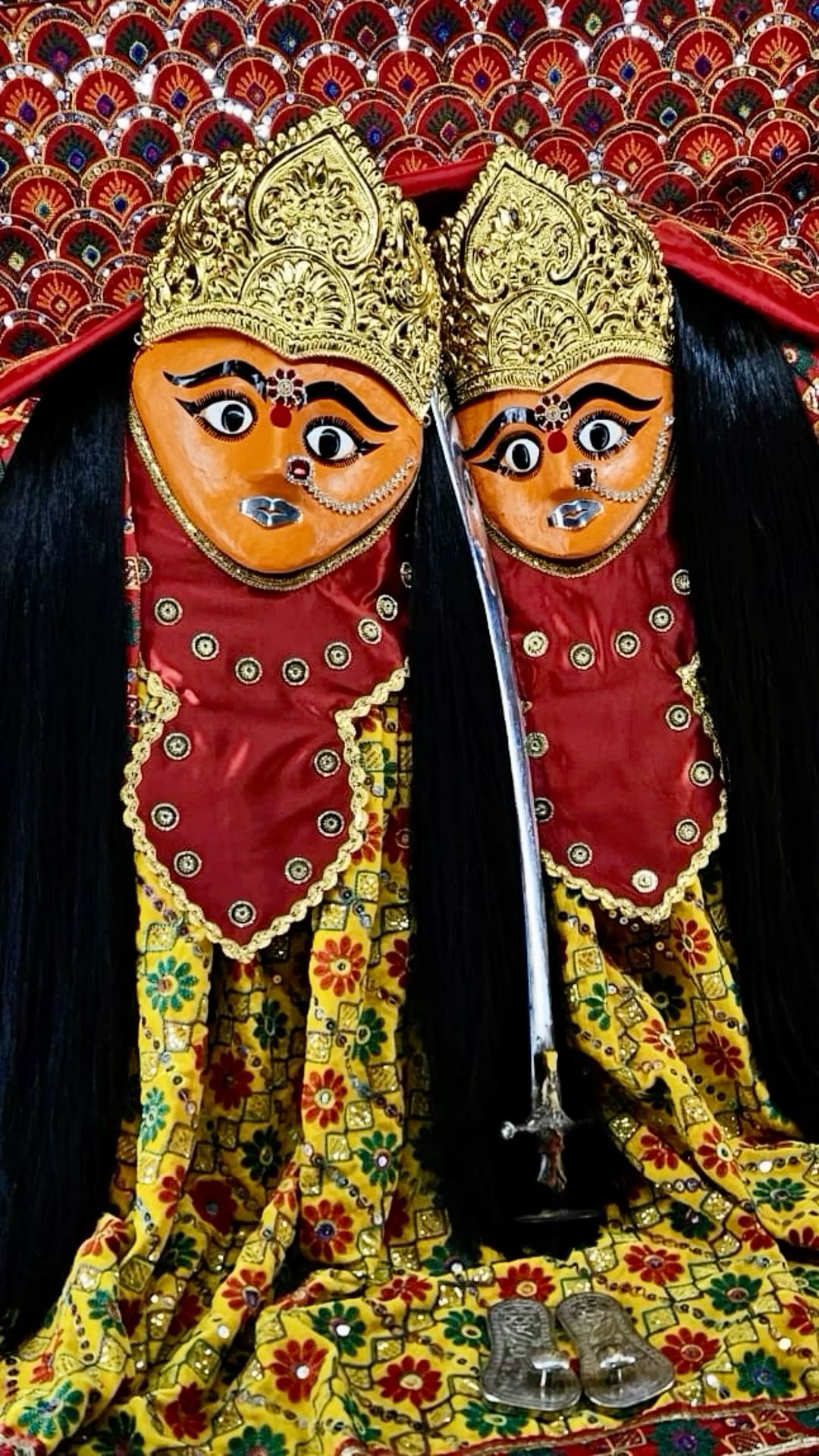 Chamunda Maa\'s crimson and gold visage.