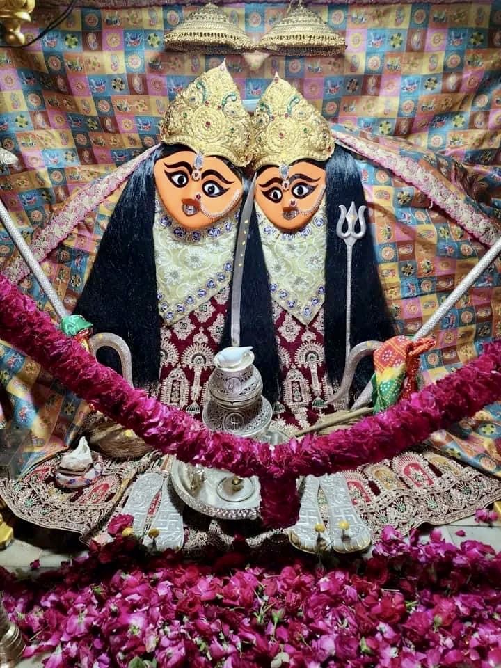 Two-headed Chamunda Maa with floral offerings