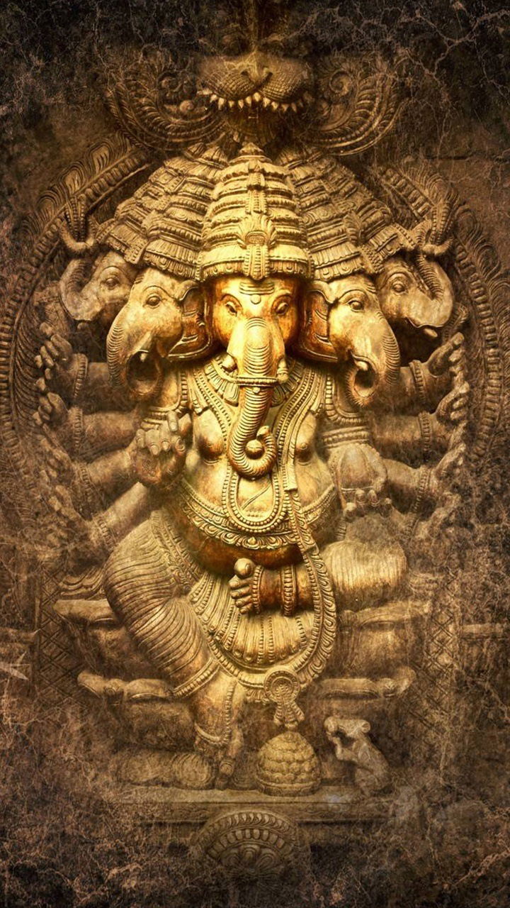 Eight-armed Ganesha sculpture, golden hue