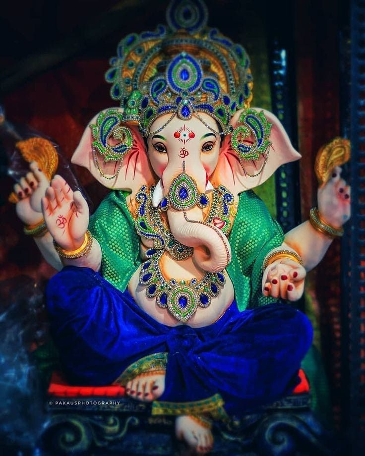 Lord Ganesha adorned with flowers and jewels