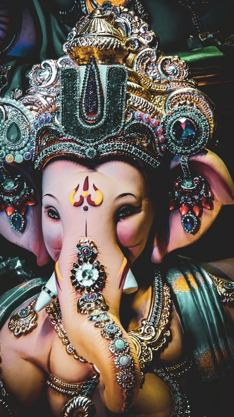 Close-up of beautifully decorated Ganesha idol.