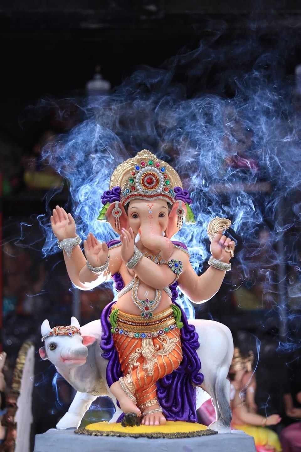 Lord Ganesha blessing with smoke backdrop