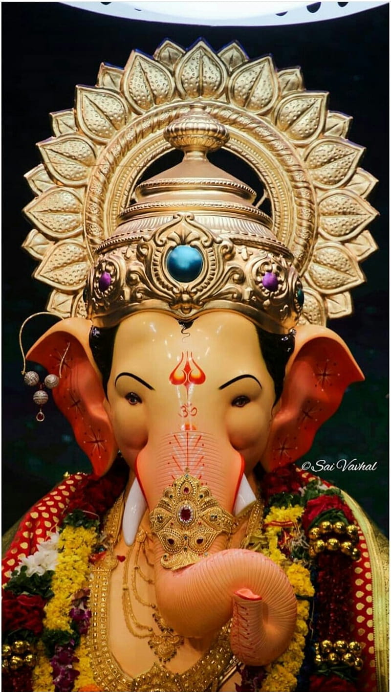 Ornate Ganesha idol with lotus halo