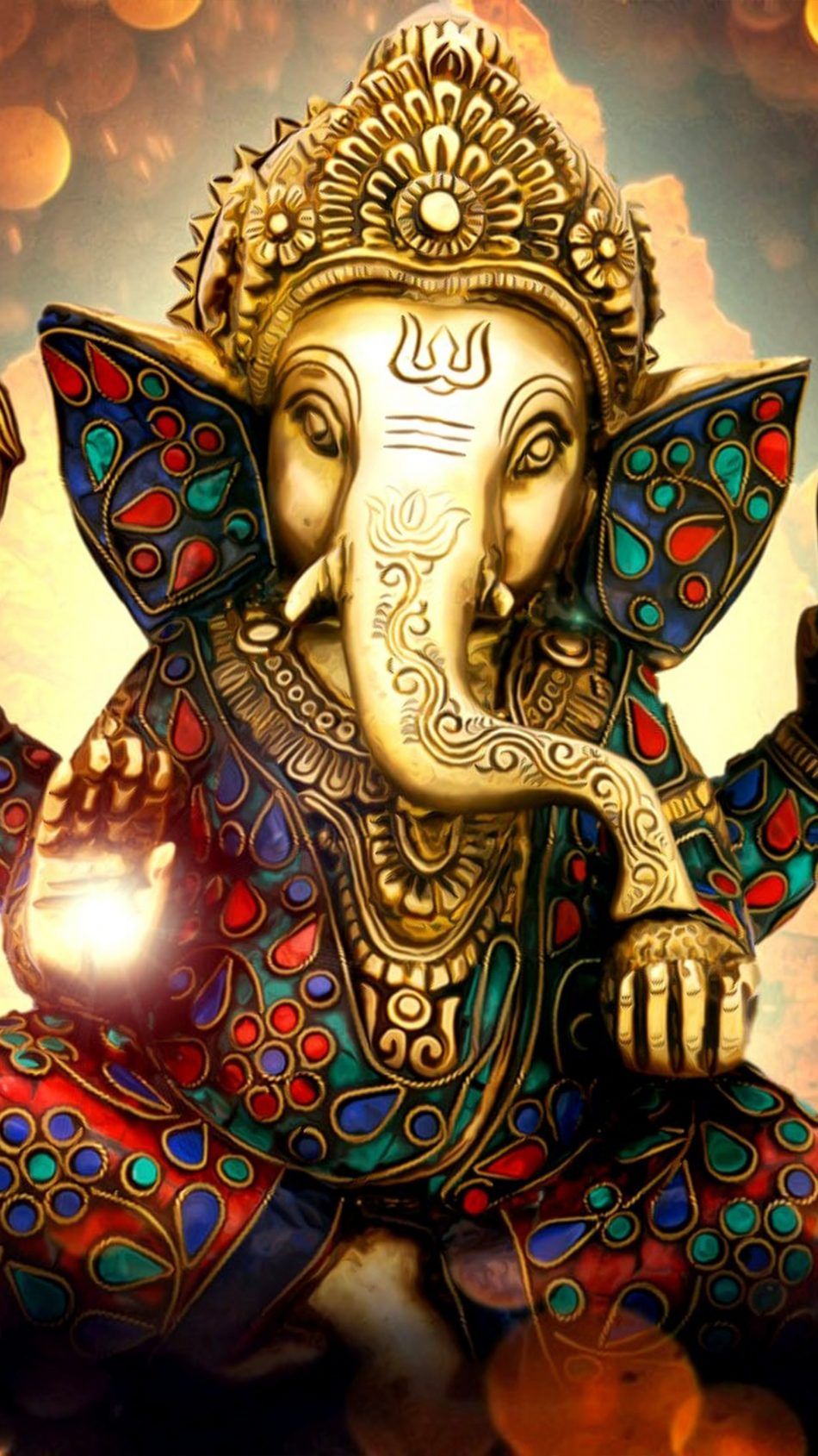 Golden Ganesha statue with intricate details
