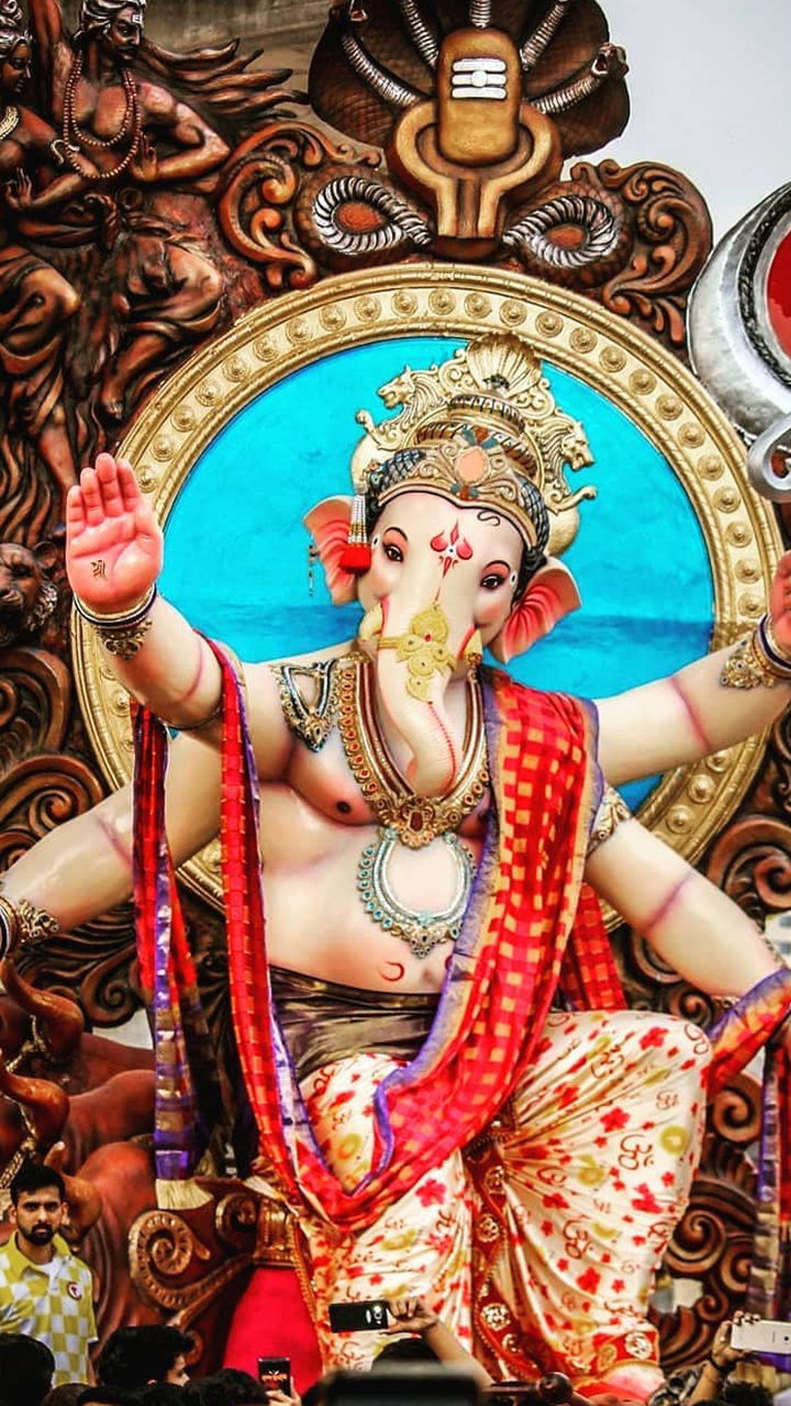 Lord Ganesha bestows blessings, ornate statue