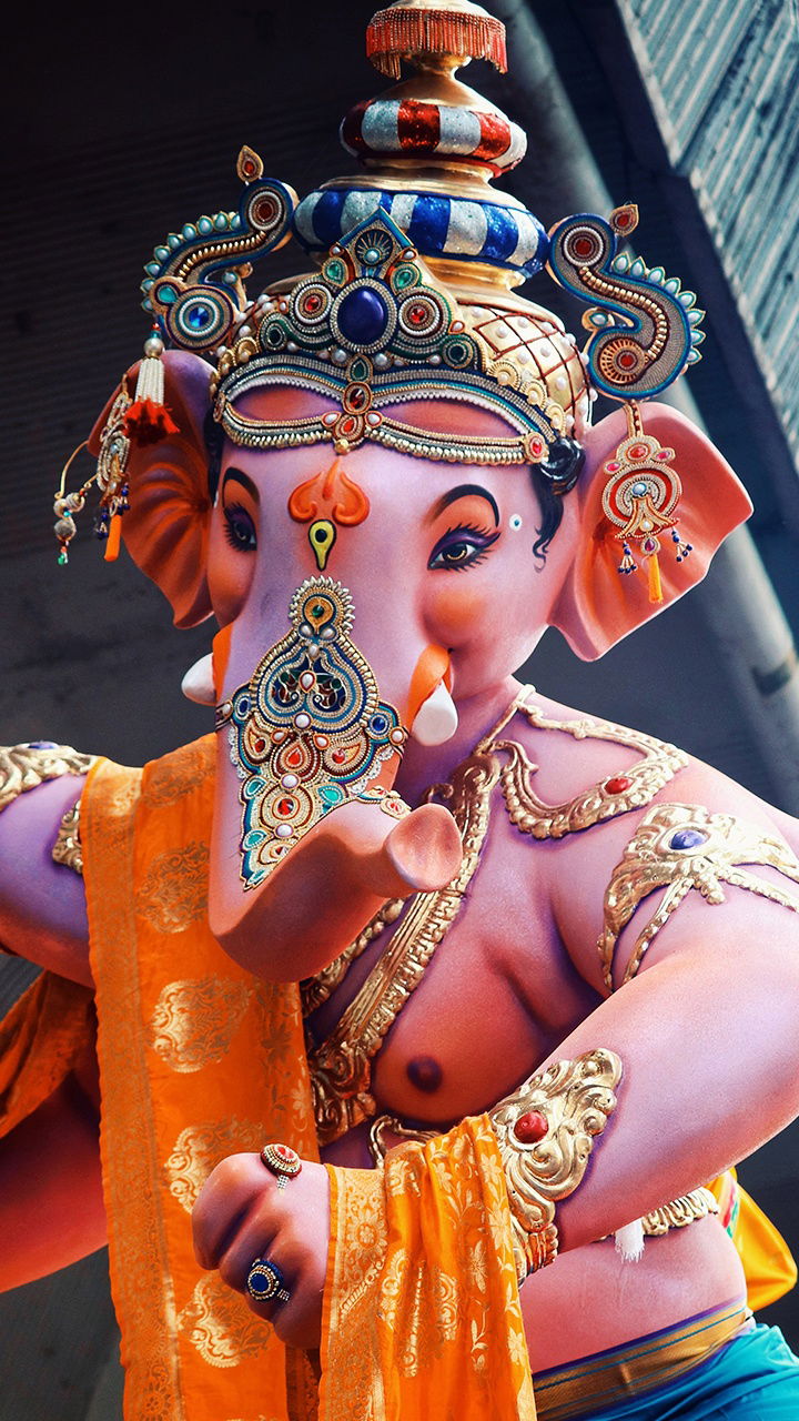 Intricate Ganesha statue with orange shawl