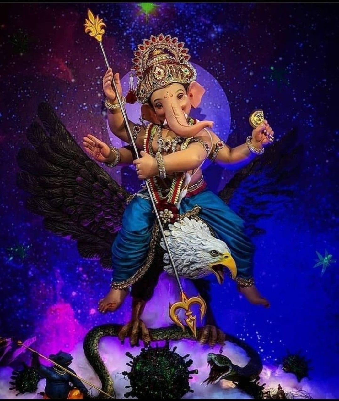 Lord Ganesha riding an eagle in space