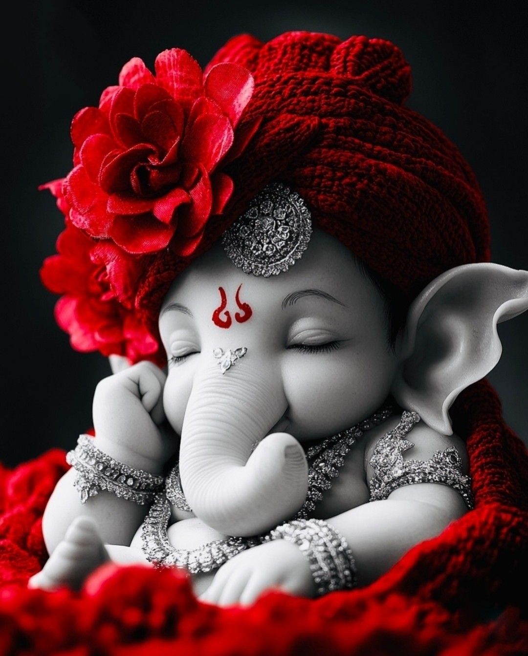 Ganesha with red flower crown.