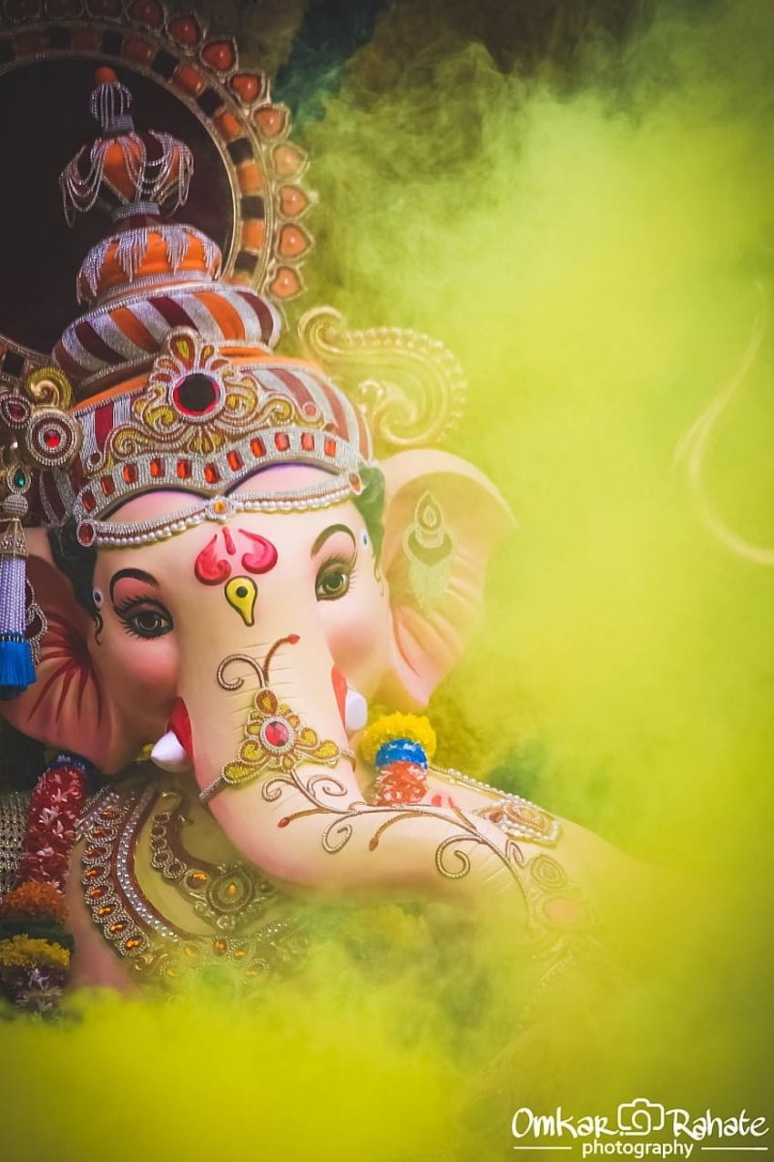 Ganesha portrait with vibrant emerald lighting