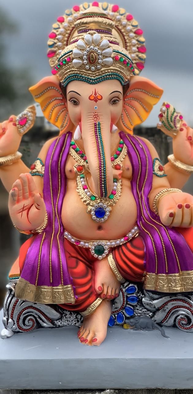 Lord Ganesha statue with vibrant decorations