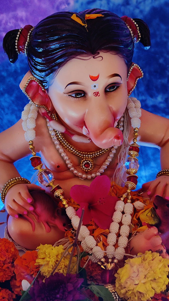 Ganesha adorned with flowers and pearls