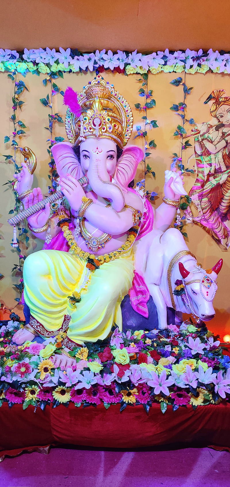 Lord Ganesha seated with flowers