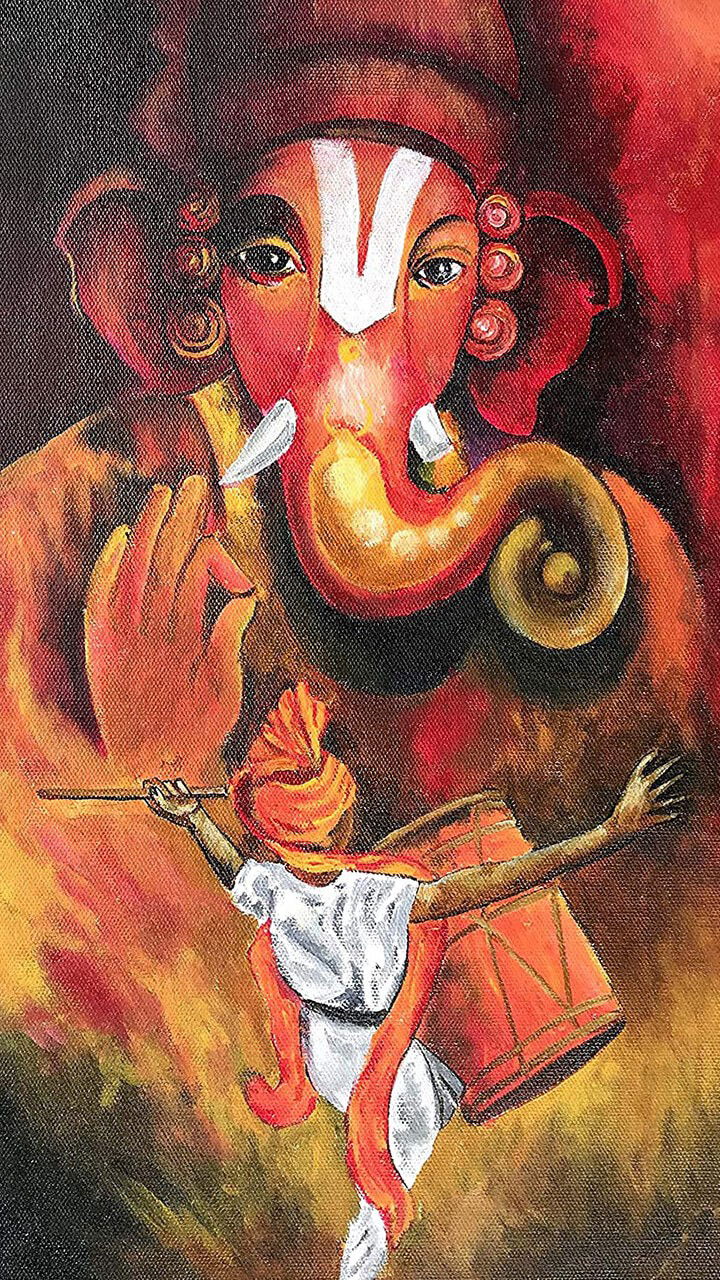 Lord Ganesha with a modak offering.
