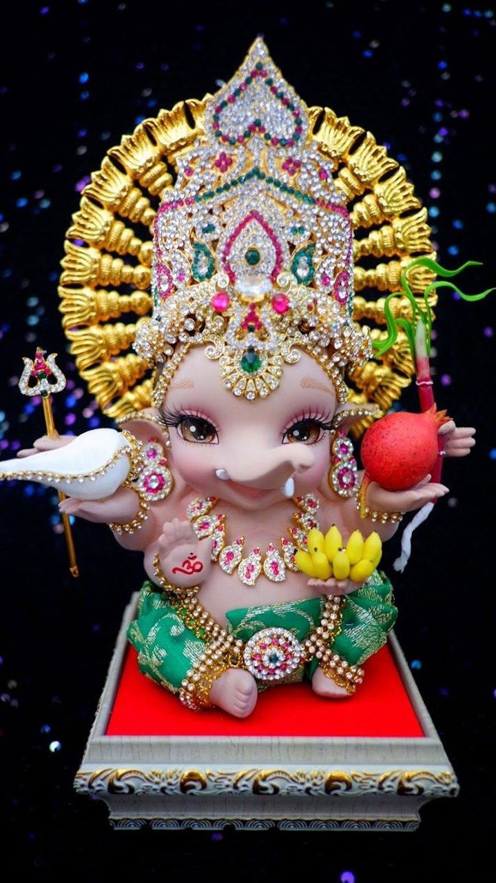 Gem-encrusted Ganesha idol with lotus