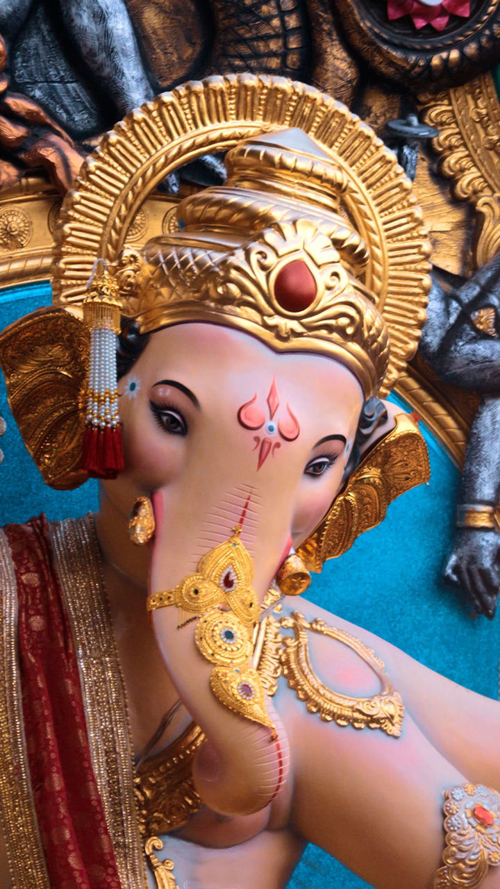 Close-up of golden Ganesha face.