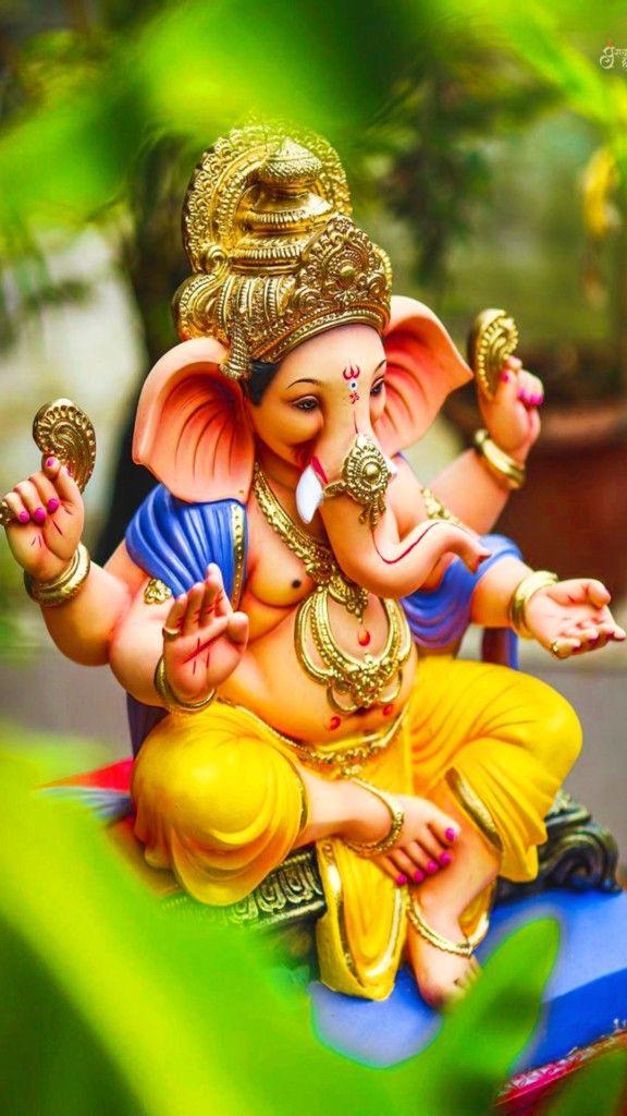 Lord Ganesha with modak and lotus