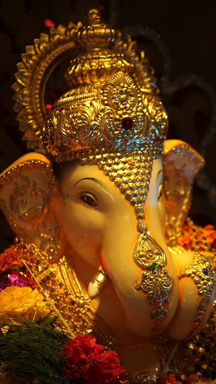 Close-up of golden Ganesha idol