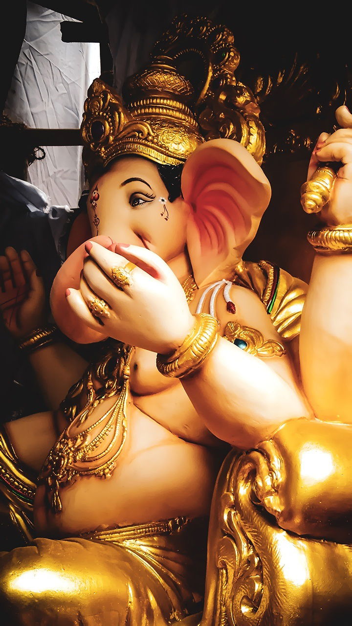 Close-up of golden Ganesha idol